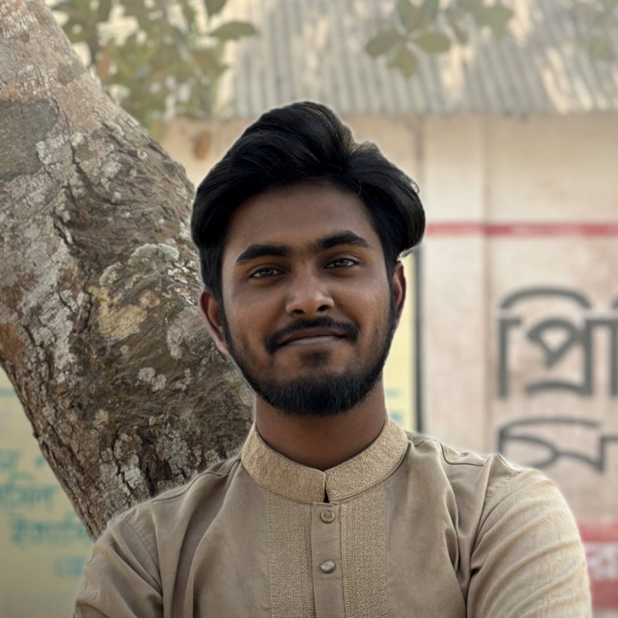 Nayem Hossain in a beige panjabi, outdoors by a tree