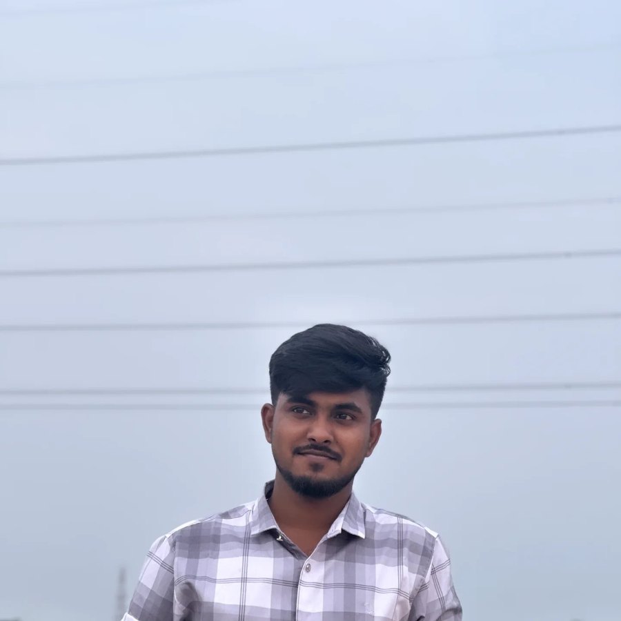 Nayem in a check shirt against the sky